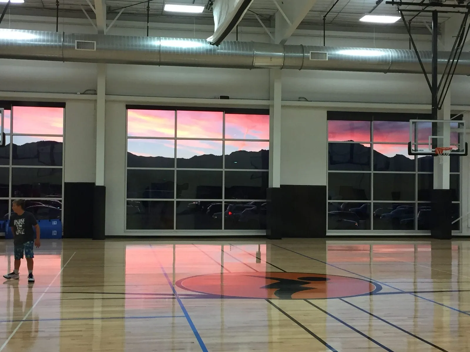 Sunset over the mountains seen from the facility windows