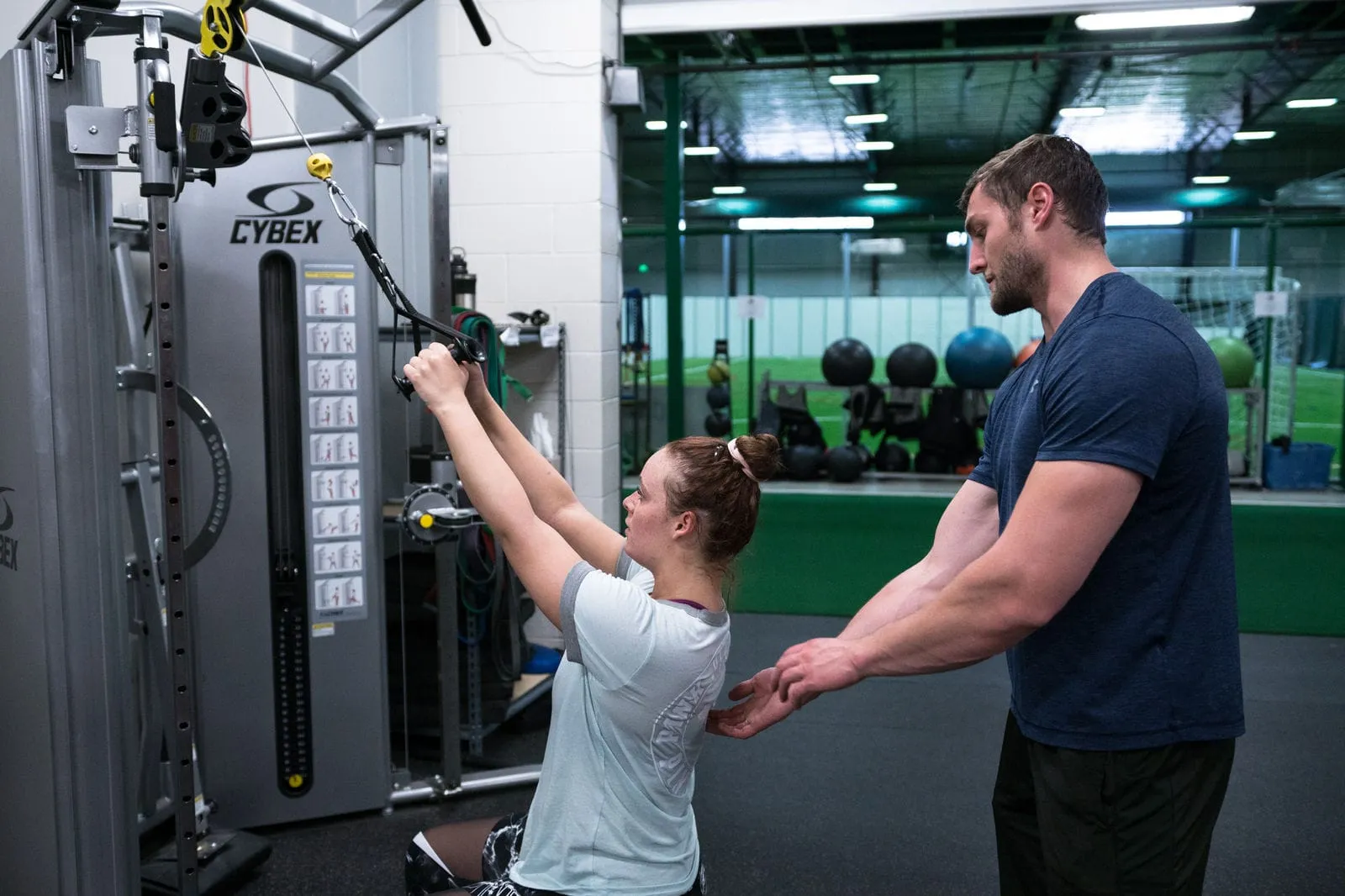 A personal training session on the cable machine
