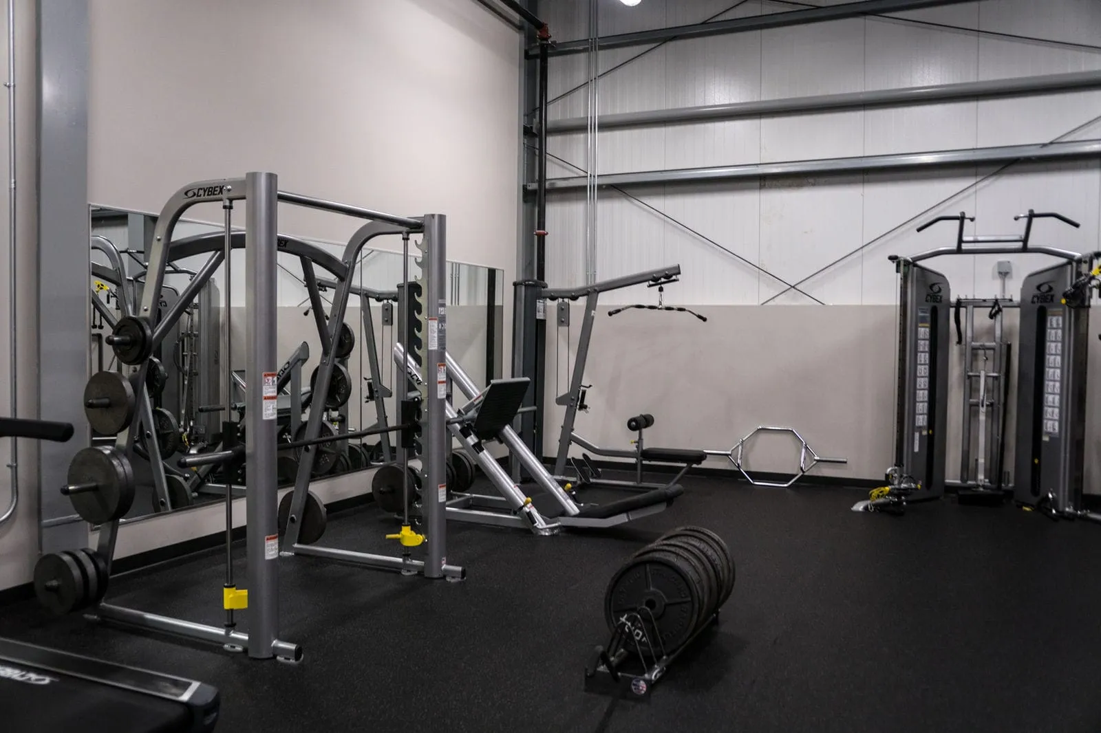 Personal training gym with strength machines